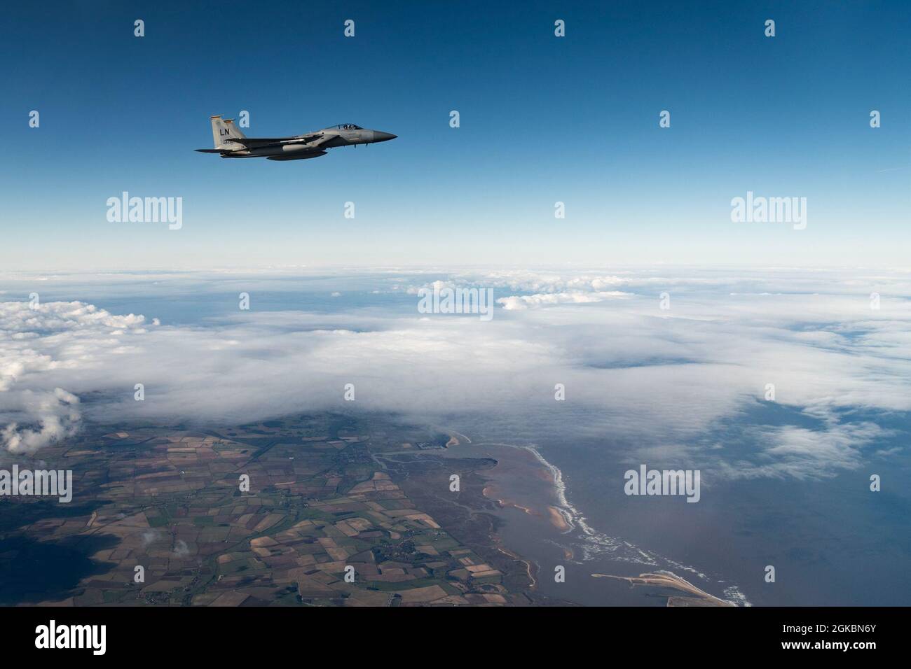 A U.S. Air Force F-15C Eagle assigned to the 493rd Fighter Squadron, flies en route to the North Sea to conduct routine aerial operations, March 5, 2021.  The 493rd conducts routine daily training to ensure the 48th Fighter Wing brings unique air combat capabilities to the fight when called upon. Stock Photo