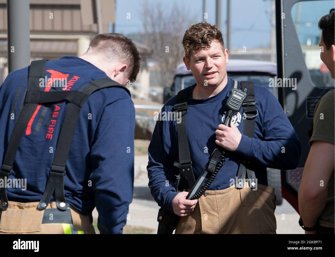 U.S. Air Force Staff Sgt. John Cools, 8th Civil Engineer Squadron firefighter crew chief, debriefs his team after a successful exercise at Kunsan Air Base, Republic of Korea, 5 March 2021. Frequent training exercises keep Kunsan AB firefighter personnel mission-ready. Stock Photo