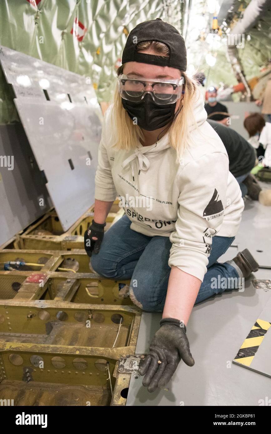 brooke selfridge 564th aircraft maintenance squadron amxs sheet metal helper shows an unused rivet she found while searching for foreign objects and debris onboard a kc 135 stratotanker aircraft at tinker air force base okla march 5 2021 selfridge is part of the 564th amxss sheet metal vocational program which teaches new employees best practices for working at the oklahoma city air logistics complex and on the kc 135 as part of the class students perform work aboard aircraft such as inspecting components and removing fod 2GKBP81