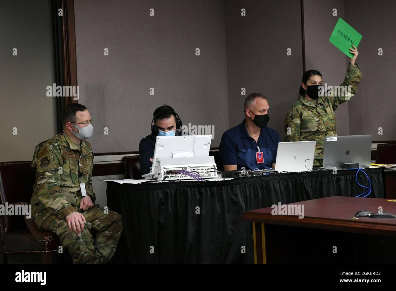 Washington Air National Guard members from the Western Air Defense Sector work together on a broadcast for the Annual Awards Ceremony held at the Western Air Defense Sector, Joint Base Lewis McChord, Wash., March 6, 2021. The awards and presentations for 2020 were held virtually due to COVID-19 precautions and broadcast around the state to service members. Stock Photo