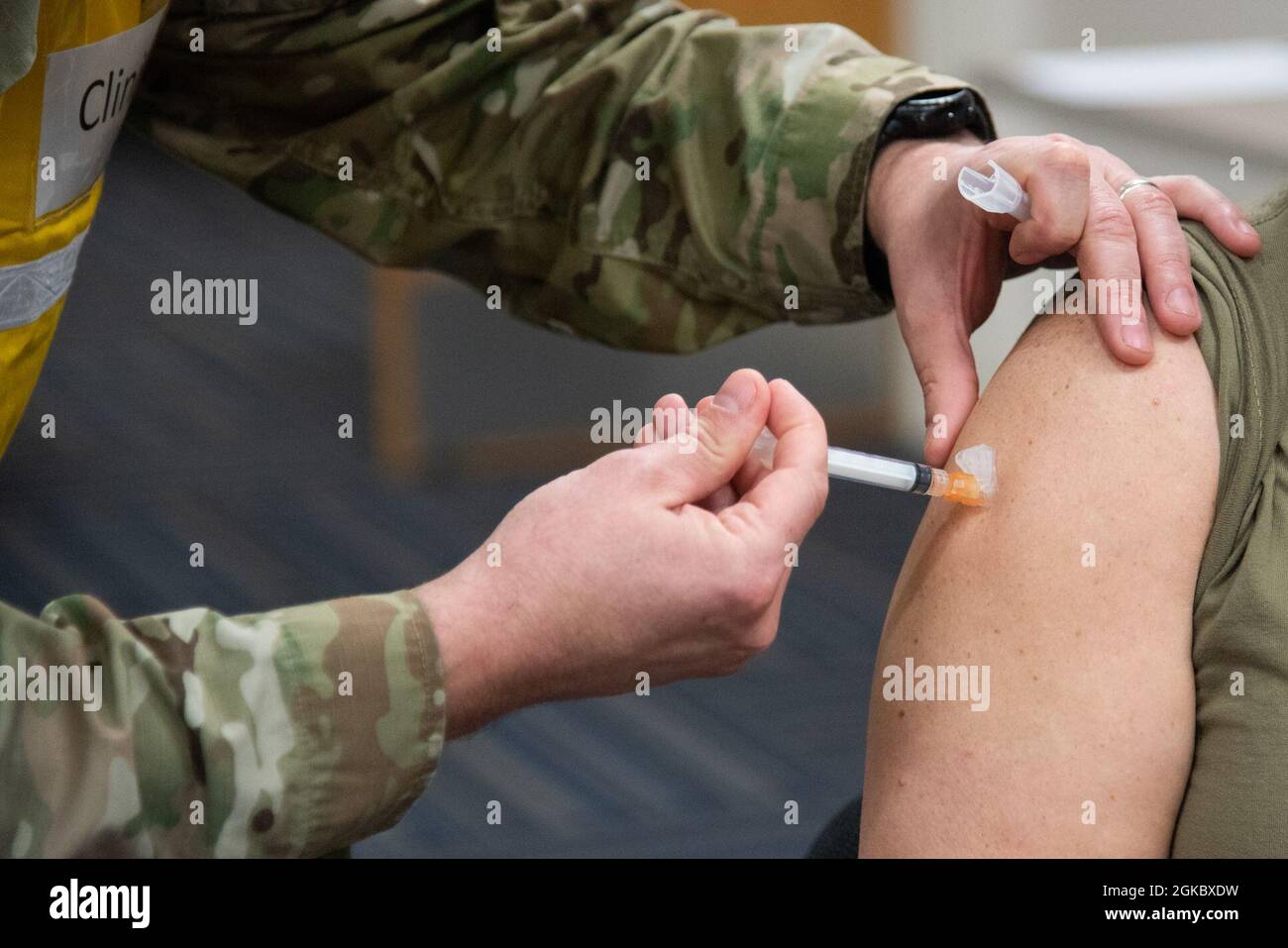 A Reserve Citizen Airman receives their second dose of the Moderna COVID-19 vaccine from the 913th Aerospace Medicine Squadron on Sunday, March 7, 2021, at Little Rock Air Force Base, Arkansas. The two-dose vaccines were recently approved by the Food and Drug Administration under an emergency use authorization and are currently offered to DoD personnel on a voluntary basis. Stock Photo