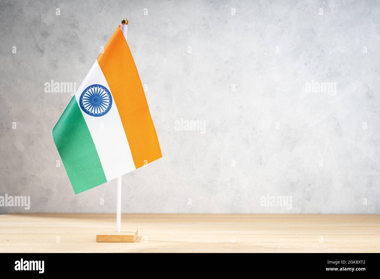 India table flag on white textured wall. Copy space for text, designs or drawings Stock Photo