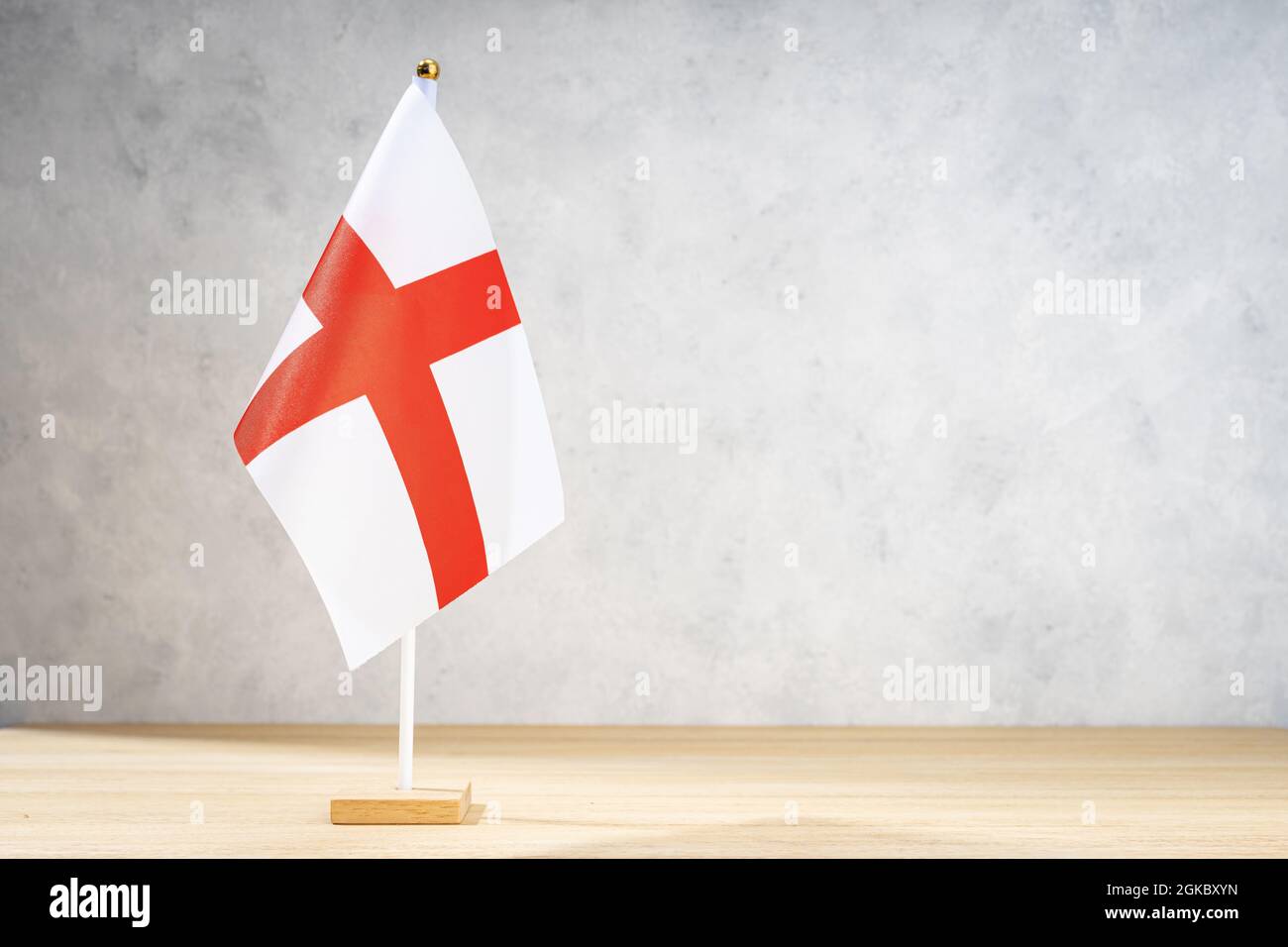 Alessandria table flag on white textured wall. Copy space for text, designs or drawings Stock Photo