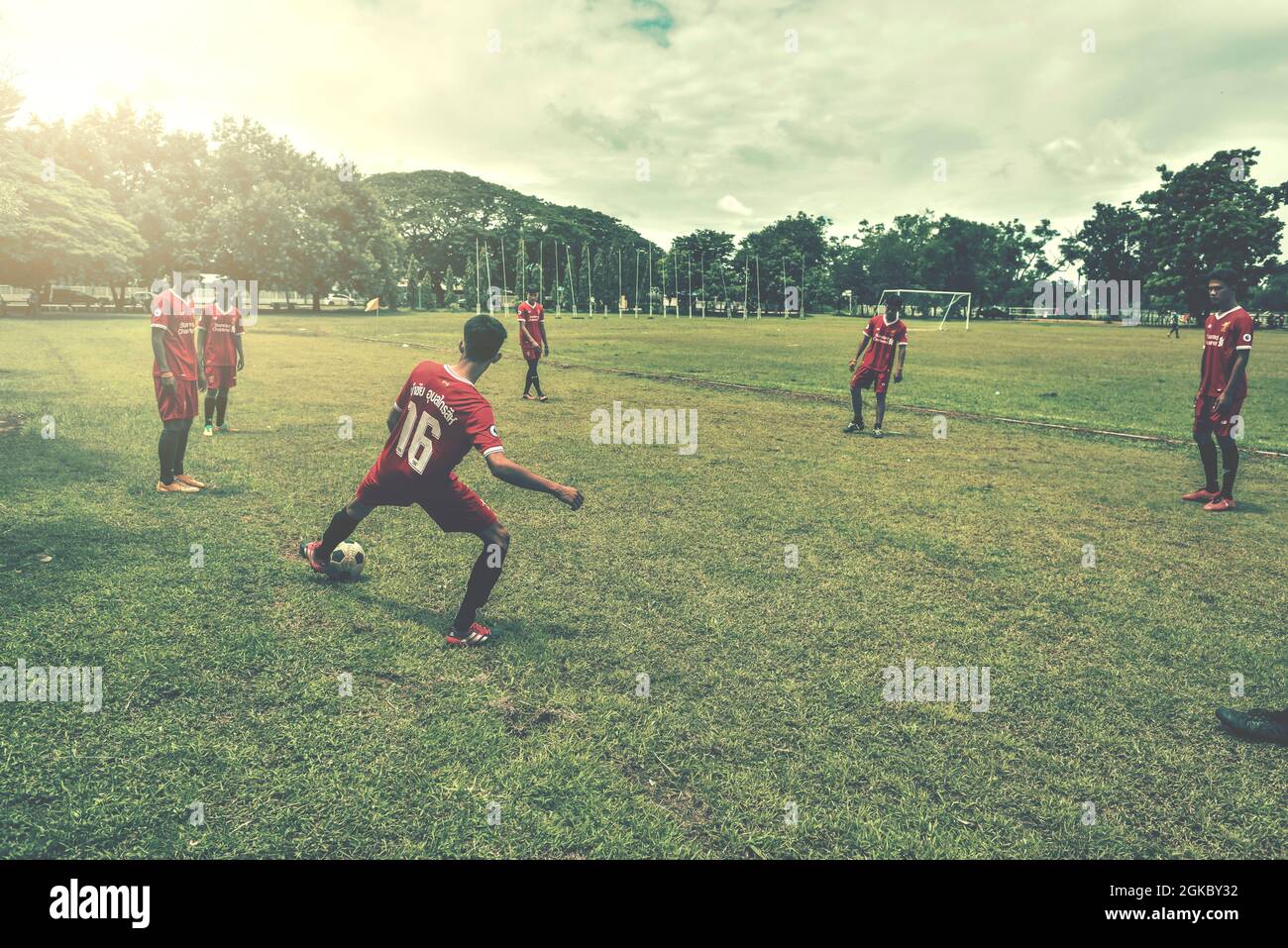 BURIRAM,THAILAND - JUNE 25,2017: UnIdentified of Youth Football Players Kicking on Wet School Football Field after rain To Welcome The World Cup Seaso Stock Photo