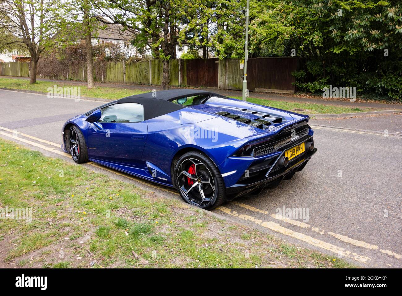 Blue Lamborghini parked on double yellow lines, UK Stock Photo