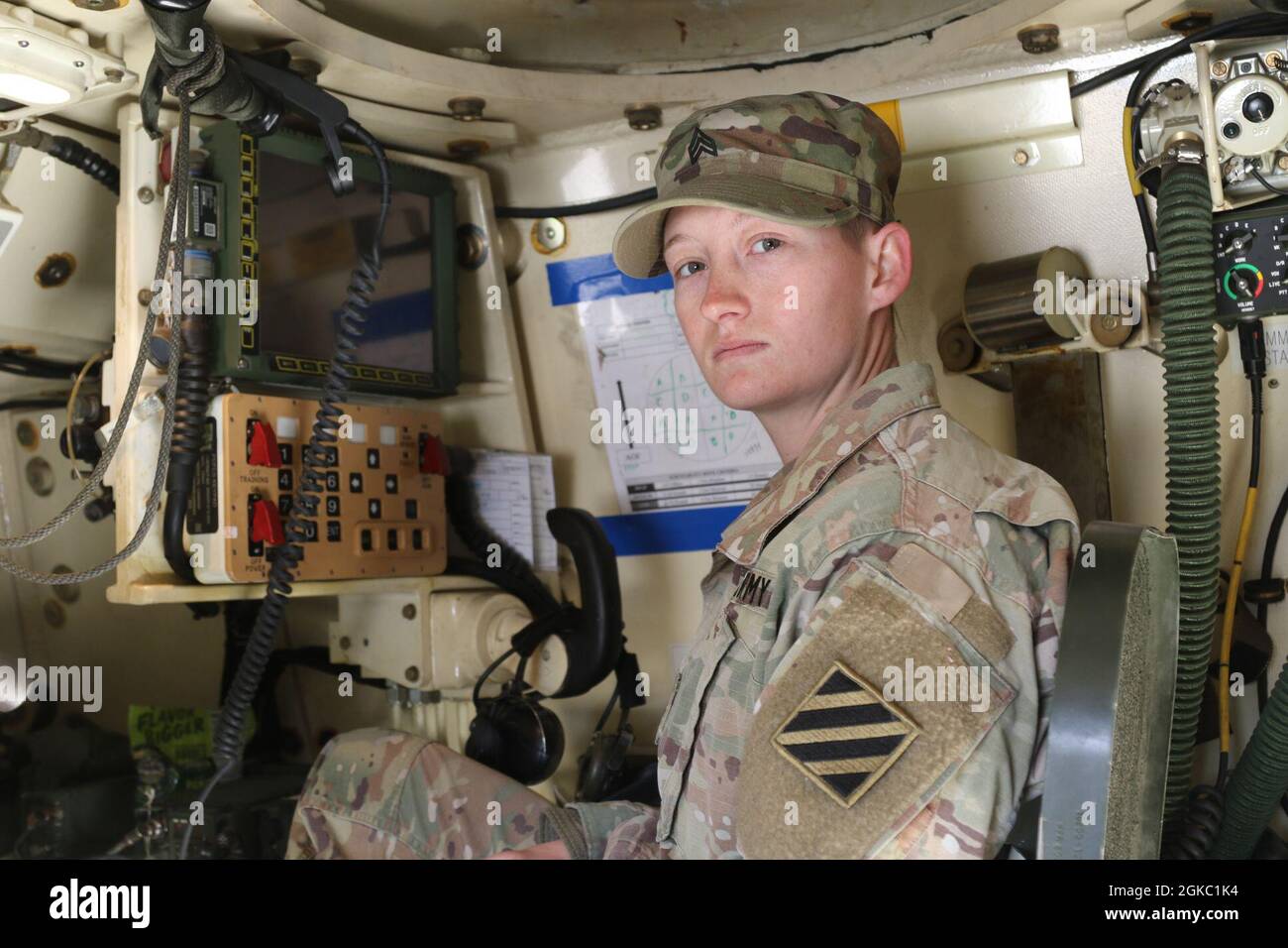 Sgt. Julie Broadway, from the 1st Battalion, 41st Field Artillery Regiment, 1st Armored Brigade Combat Team, 3rd Infantry Division, poses for a photo inside her M109A6 Paladin at the Rodriguez Live Fire Range Complex, Republic of Korea, March 9, 2021. Broadway is the female section chief in 1-41FA and says, “To all the females in my mos (military occupational specialty) and who want to be a section chief, just keep putting in the hard work and don’t let anything bring you down, even on days when you feel like it's a struggle.” Stock Photo