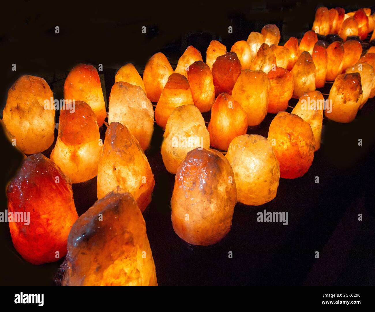 Himalayan pink salt lamps for sale at flea market Stock Photo Alamy