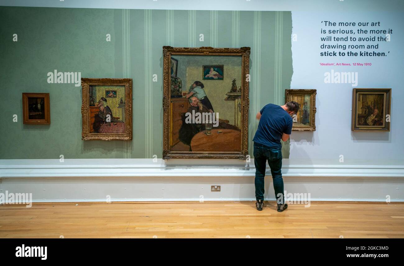 A staff member hangs a painting during a photo call for the Sickert: A Life in Art exhibition at the Walker Art Gallery, Liverpool, a major retrospective of artist Walter Richard Sickert. Picture date: Tuesday September 14, 2021. Stock Photo