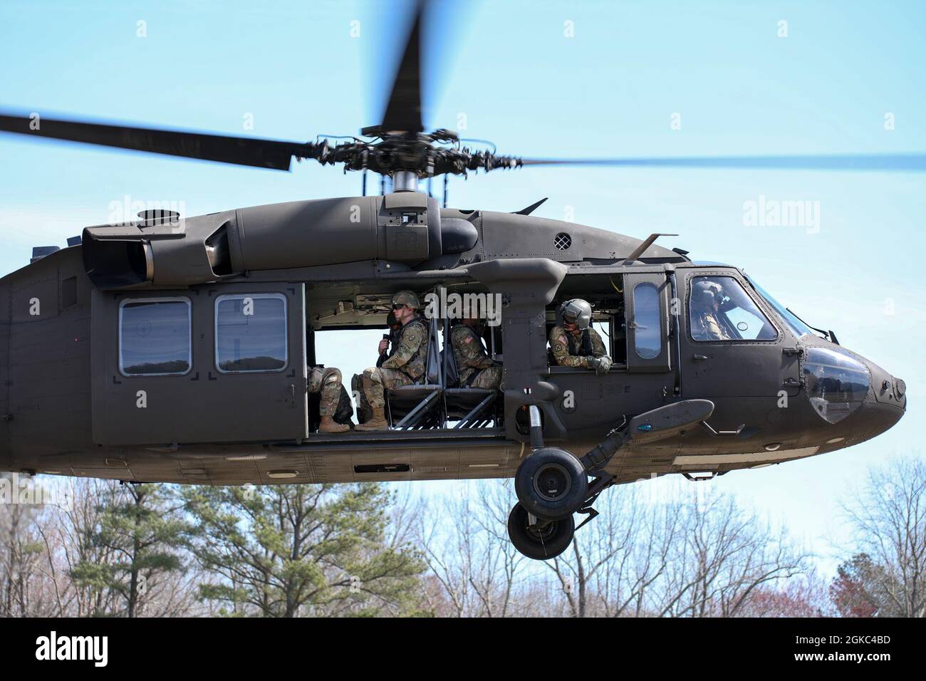 North Carolina National Guard Soldiers ride in a Black Hawk Helicopter