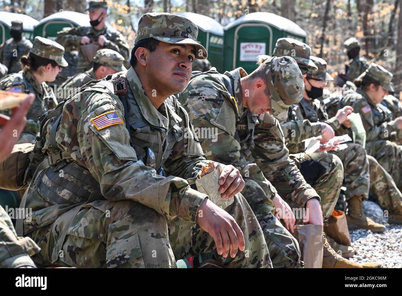 U.S. Army Soldiers open and eat MRE's (Meals Ready to Eat) during a