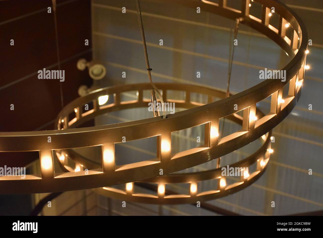 Two Big Glowing Chandeliers Close Up Stock Photo