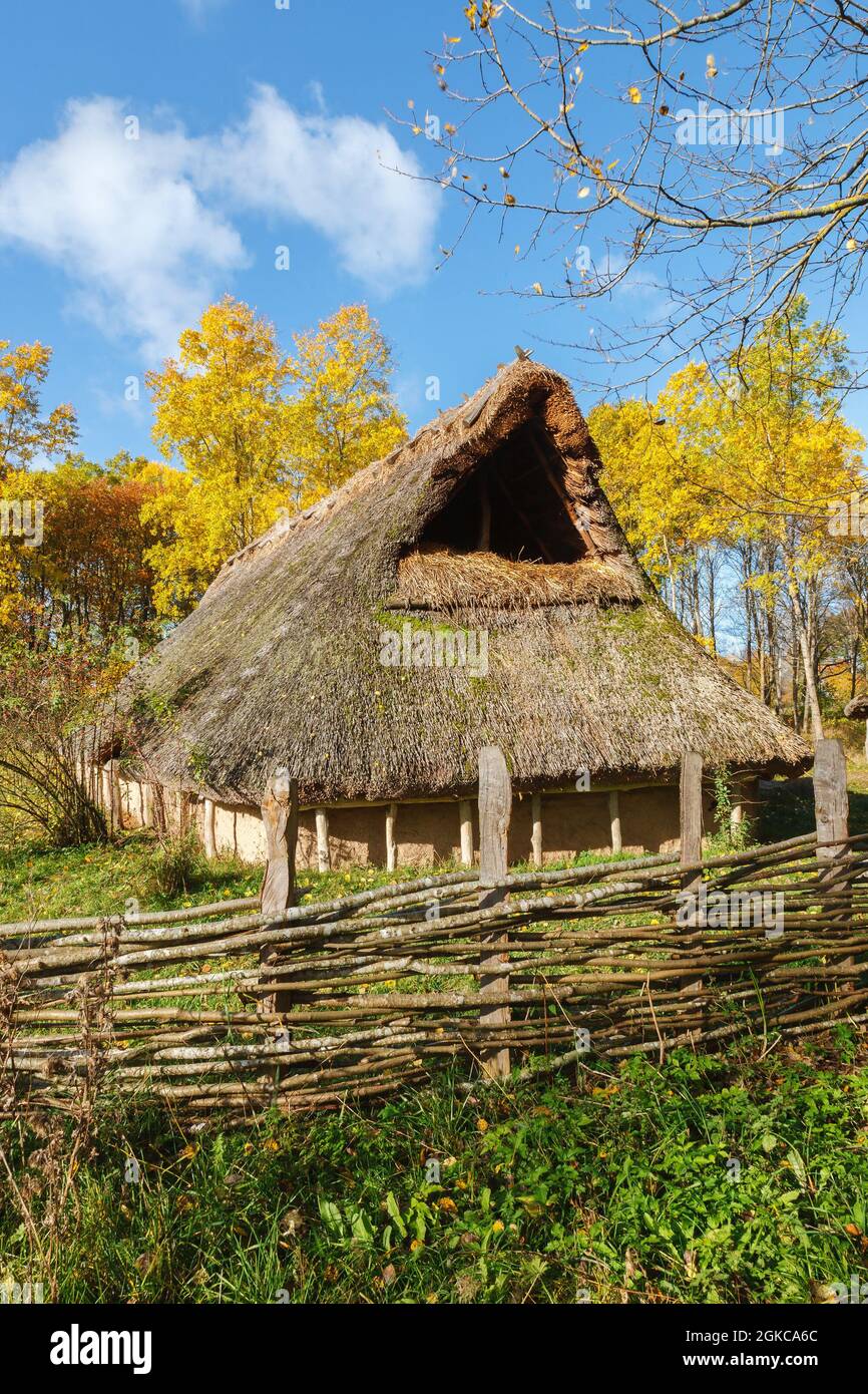 Gable on a longhouse with a branch braided fence Stock Photo