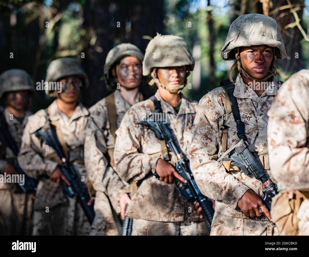 Recruits assigned to Papa Company, 4th Recruit Training Battalion, assemble as a squad during the Crucible on Marine Corps Recruit Depot Parris Island, South Carolina, March 11, 2021. The Crucible is a culminating event that tests recruits mentally and physically, it is the final step before becoming a U.S. Marine. Stock Photo