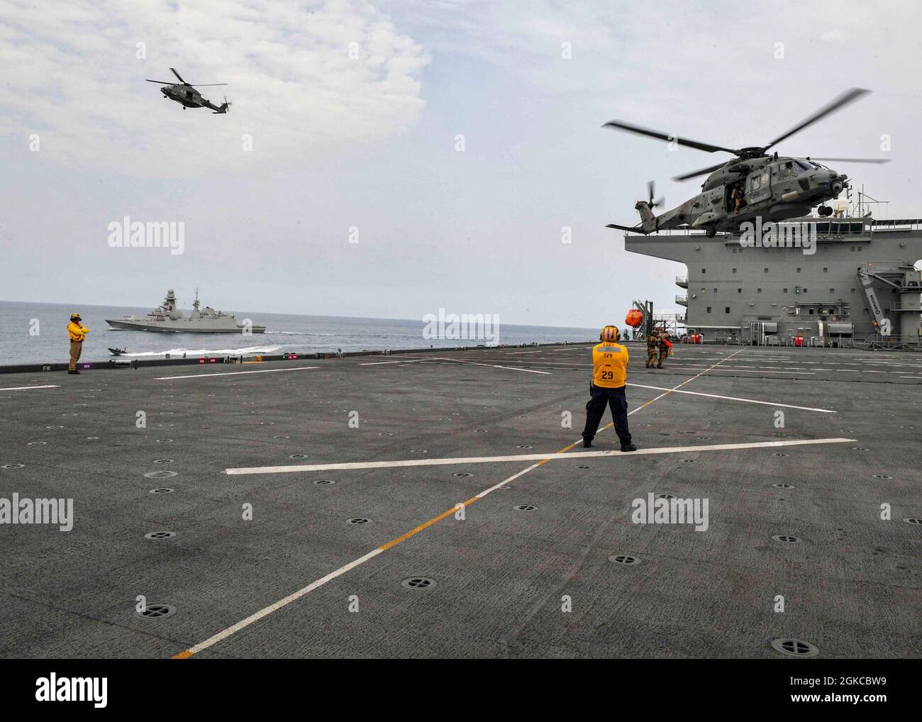ATLANTIC OCEAN (Mar. 11, 2021) Two EH101 Merlin helicopters from the Italian Navy practice Visit, Board, Search and Seizure operations on board the Expeditionary Sea Base USS Hershel “Woody” Williams (ESB 4) in the Atlantic Ocean, Mar. 11, 2021. Hershel “Woody” Williams is operating in U.S. Sixth Fleet to conduct interoperability training and build strategic partnerships with their African partners. Stock Photo