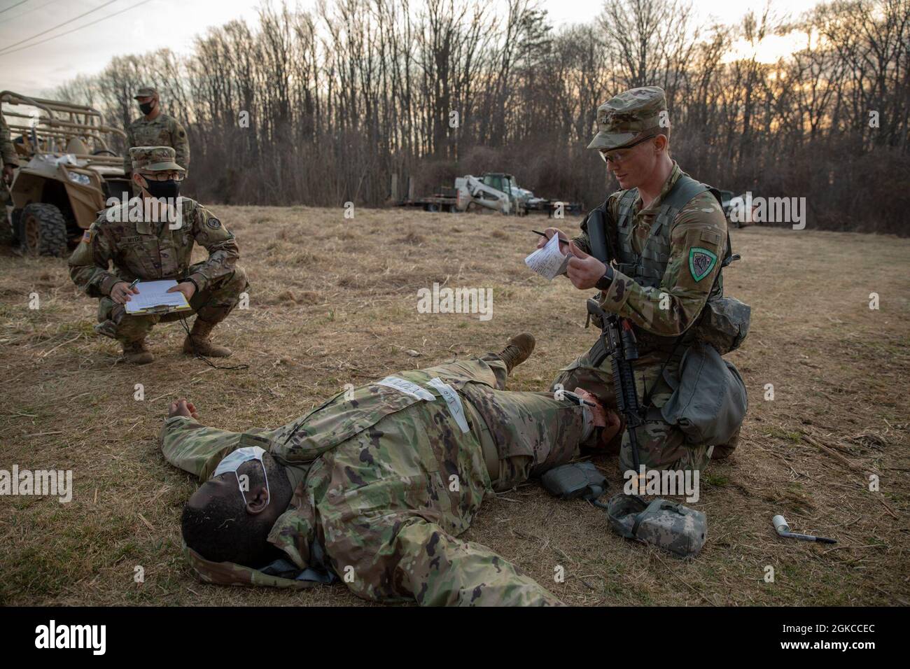 Sgt. Charles Hellmann, a military police with the 200th Military Police Company, provides medical aid to a mock casualty, during the 2021 Maryland Best Warrior Competition at H Steven Blum Military Reservation in Glen Arm, Maryland, on March 11, 2021. The competition is a multi-day marathon of mental and physical trials, pushing these elite Service members to their limits. This year’s competition took place from March 11-14. Extensive sanitary safety precautions made sure the competitors could safely display the best of their skills. Stock Photo