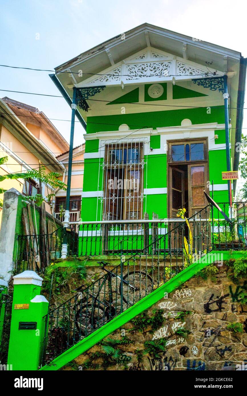 Low angle view of a colonial style architecture building painting in vibrant green color in the Santa Teresa district in Rio de Janeiro, Brazil. This Stock Photo