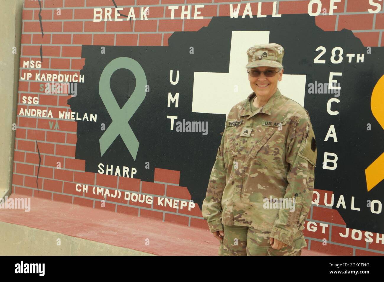 U.S. Army Staff Sgt. Andrea Whelan, victim advocate for the 28th Expeditionary Combat Aviation Brigade, poses for a photo at an airfield in the 28th ECAB's area of operations in the Middle East.     Whelan enlisted in the U.S. Army at age 32 after losing a truth or dare bet. She says that someone told her she would not make through basic training, and now she is standing at retirement's doorstep. She is currently attending Liberty University pursuing a bachelor's degree in psychology.    "Women's month is a time of reflection for me", said Whelan. "I look at all the of the great women who forg Stock Photo
