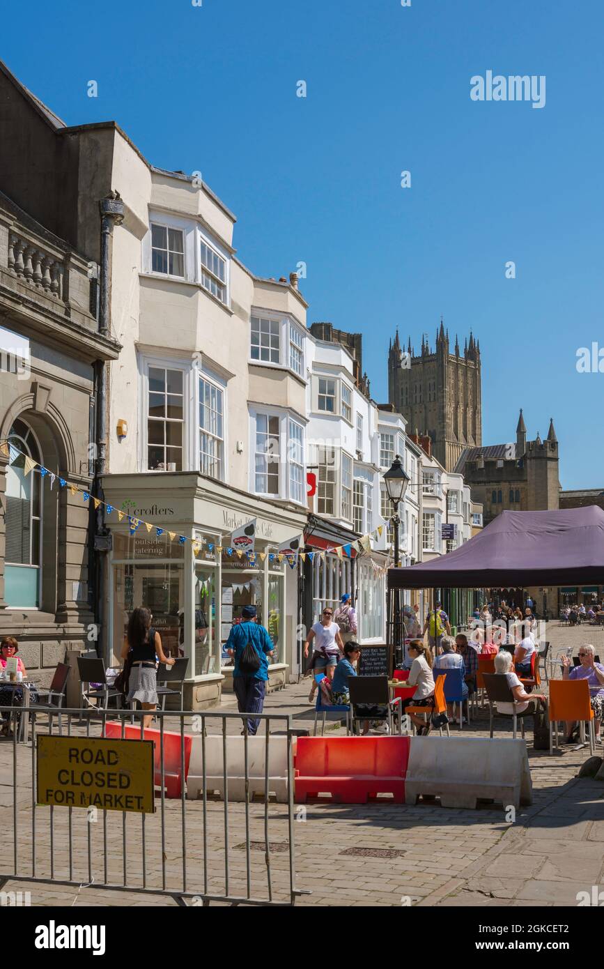 Wells UK, view in summer of people approaching Market Place from the High Street in the centre of the historic town of Wells, Somerset, England, UK Stock Photo