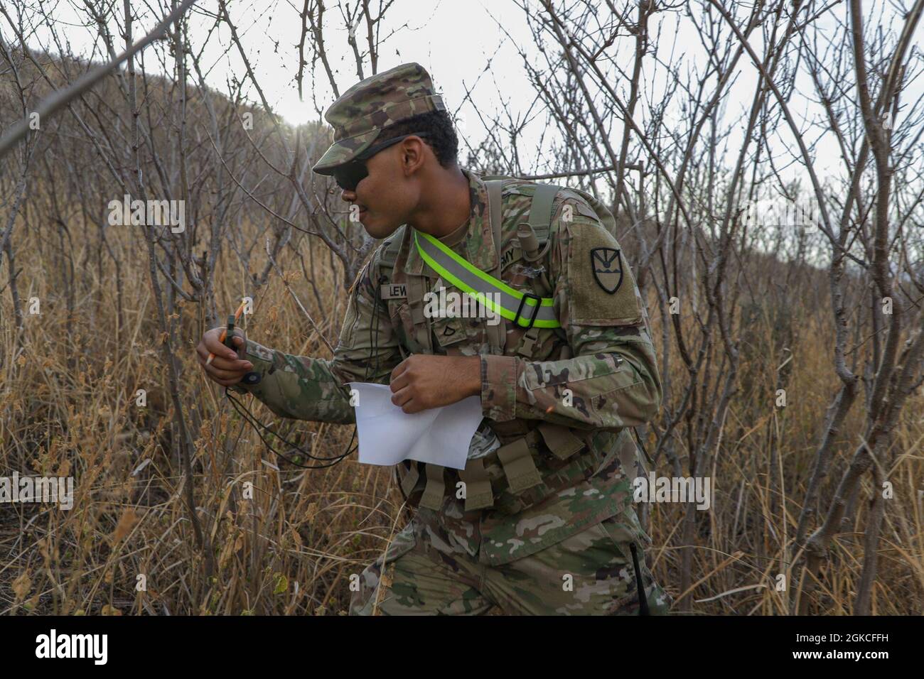 The Virgin Islands National Guard Pfc. Eddison Lewis, HHC 786th, conducts land navigation during the Best Warrior Competition, March 12, 2021.    The VING BWC is a culminating test where the competing NCOs and soldiers spend five days competing in various challenges, including firing weapons, land navigation, the Army Physical Fitness Test, and other various events. These challenges will test each competitor's knowledge, technical and tactical skills, physical endurance, mental toughness, and overall combat readiness. Stock Photo
