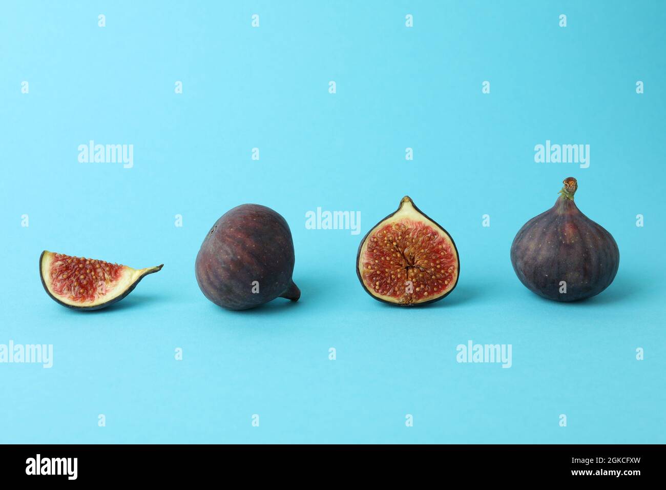 Fig on blue background, space for text Stock Photo