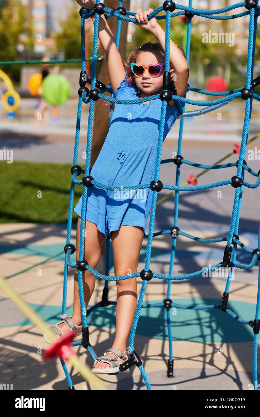 child girl having fun on playground in sunny day Stock Photo - Alamy