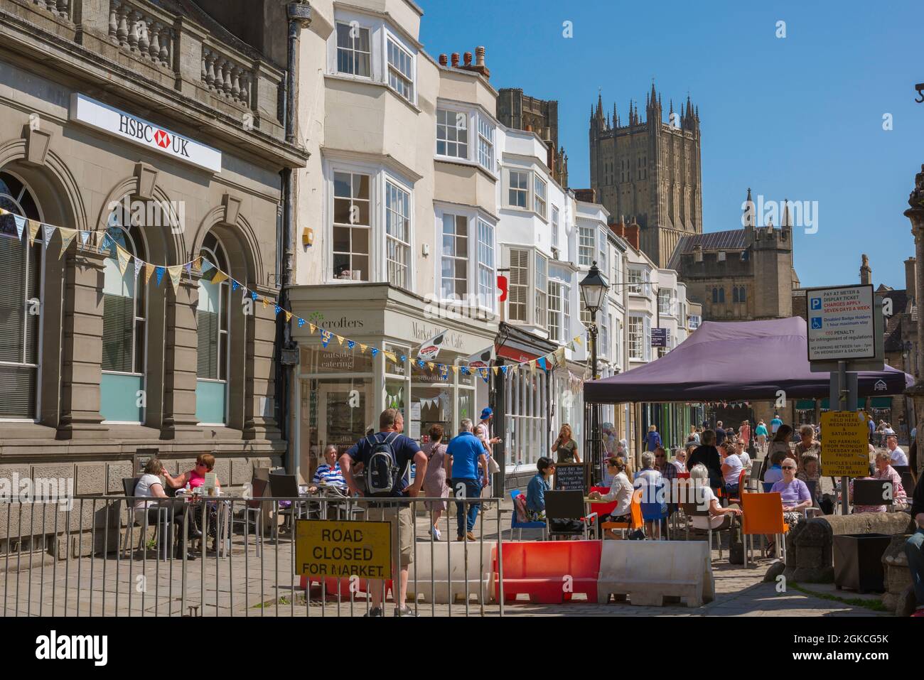 Wells UK, view in summer of people approaching Market Place from the High Street in the centre of the historic town of Wells, Somerset, England, UK Stock Photo