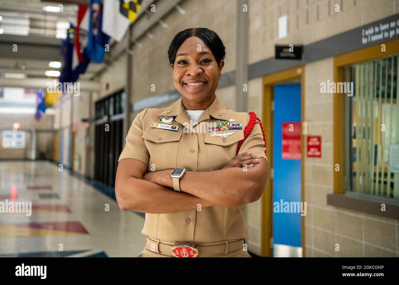 Senior Chief Yeoman Tay Yelder, a recruit division commander and In-Processing leading chief petty officer, poses for a portrait inside the Golden Thirteen In-Processing Building at Recruit Training Command. More than 40,000 recruits train annually at the Navy’s only boot camp. Stock Photo