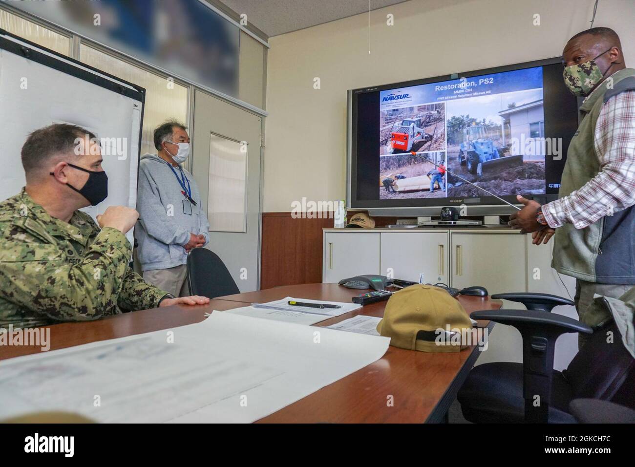 HACHINOHE, Japan (March 12, 2021) - NAVSUP Fleet Logistics Center Yokosuka Commanding Officer Capt. Edward Pidgeon (left) is briefed on Defense Fuel Service Point Hachinohe's operations after the facility was damaged by a tsunami 10 years earlier. Stock Photo