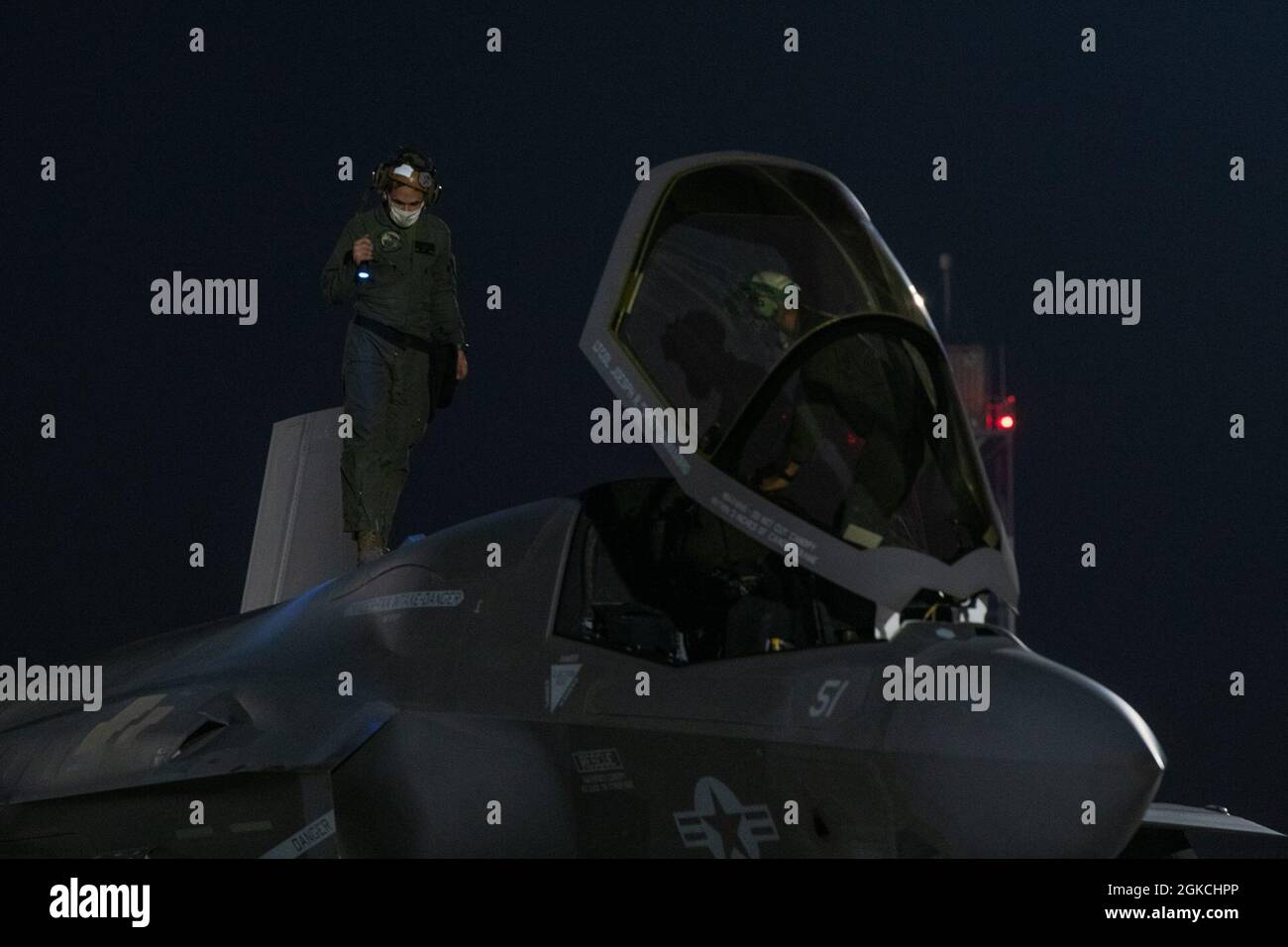 An F-35B Lightning II aircraft, assigned to the Marine Medium Tiltrotor Squadron 164 (Reinforced), 15th Marine Expeditionary Unit, is inspected after landing at Al Udeid Air Base, Qatar, March 2, 2021. The F-35B Lightning II is the United States Marine Corps variant of the 5th generation fighter. Stock Photo
