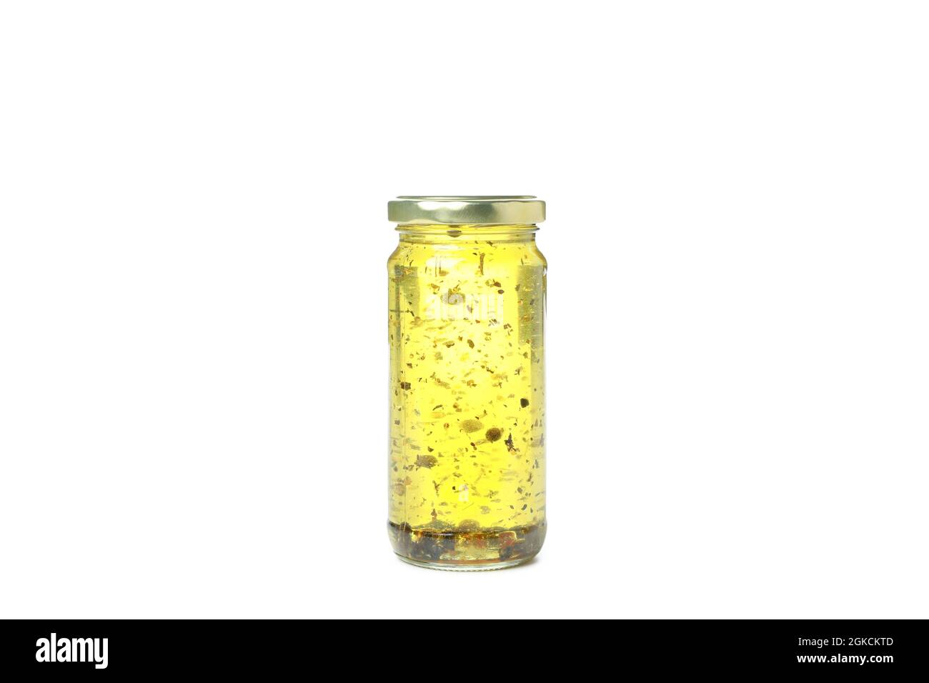 Glass jar of oil isolated on white background Stock Photo - Alamy