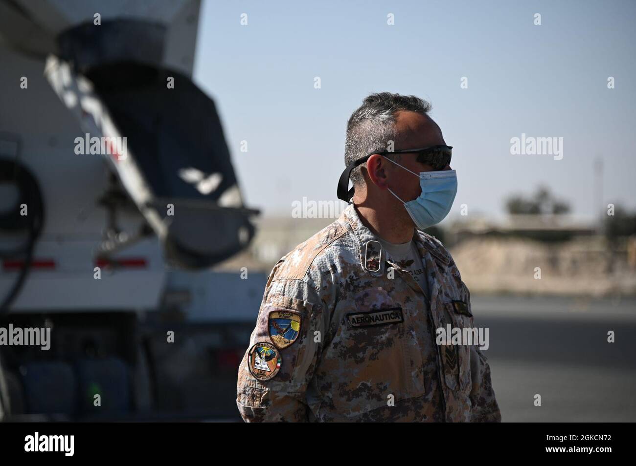 An Italian air force member prepares for a concrete pour at Ali Al Salem Air Base, Kuwait, March 14, 2021. Members assigned to the 386th Expeditionary Civil Engineer Squadron worked with joint and coalition partners to begin building a mobile aircraft arresting system. The MAAS is an emergency braking system for tail-hook-equipped aircraft. Stock Photo
