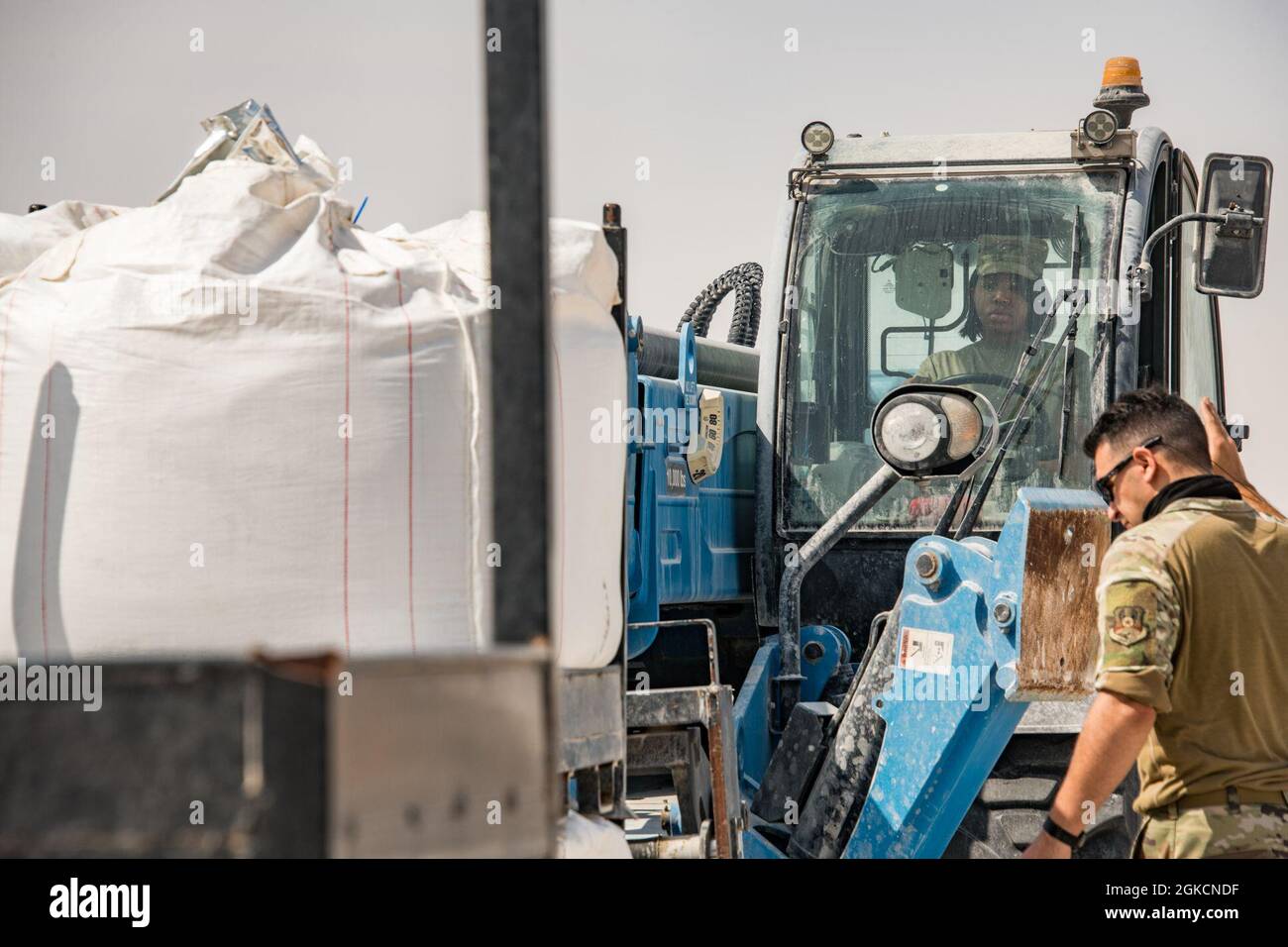 U.S. Airmen assigned to the 379th Expeditionary Civil Engineer Squadron move quicksetting