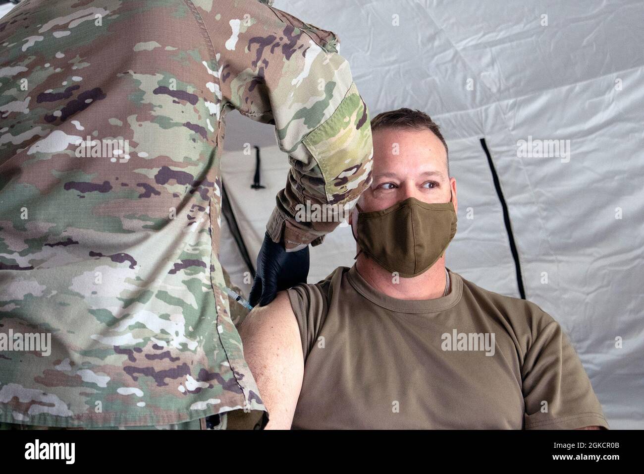 Colonel Coble Col. Mark Coble, Al Asad Air Base commander, receives the COVID-19 ...