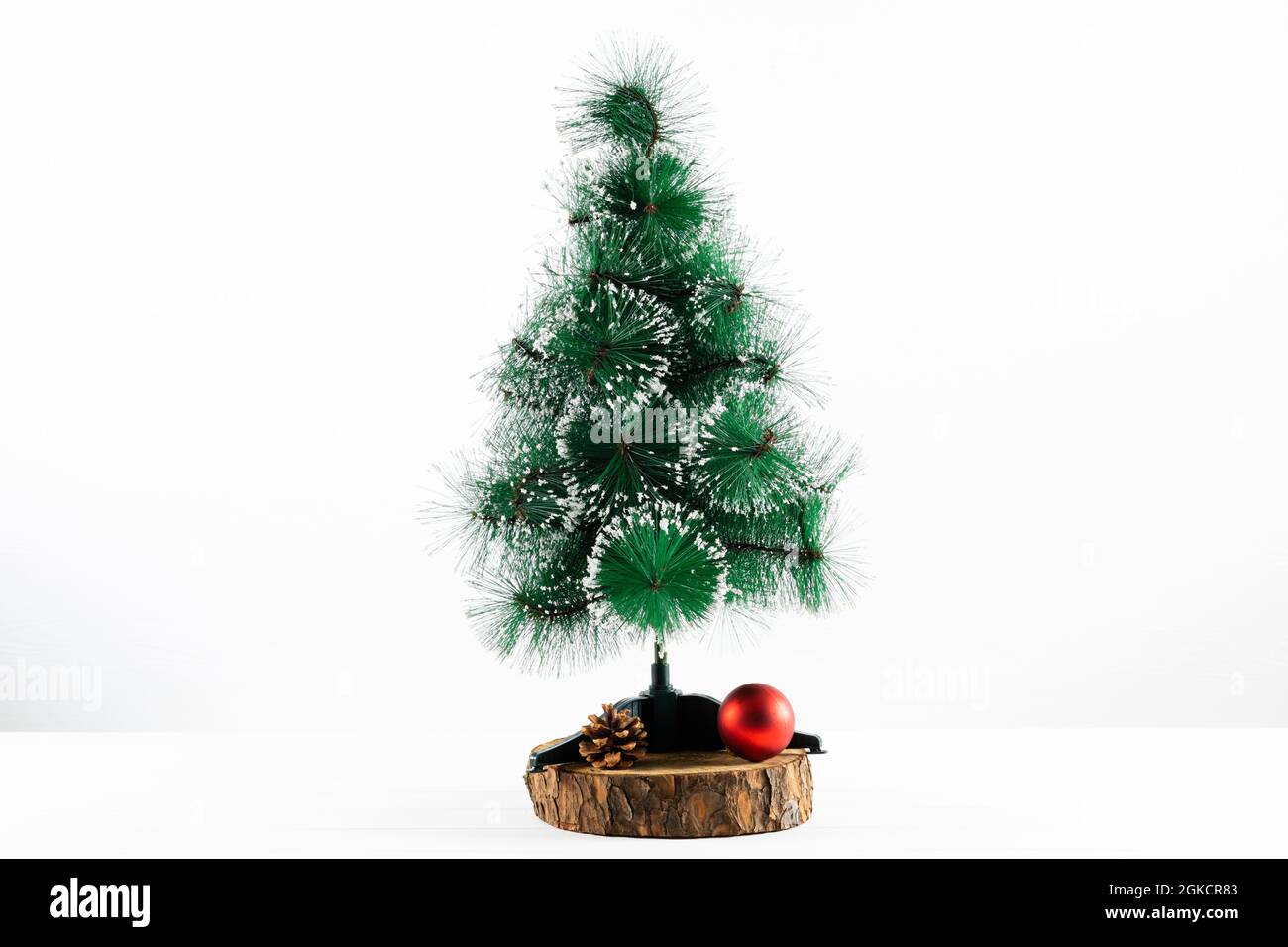 Composition of christmas decorations with fir tree and bauble on white background Stock Photo