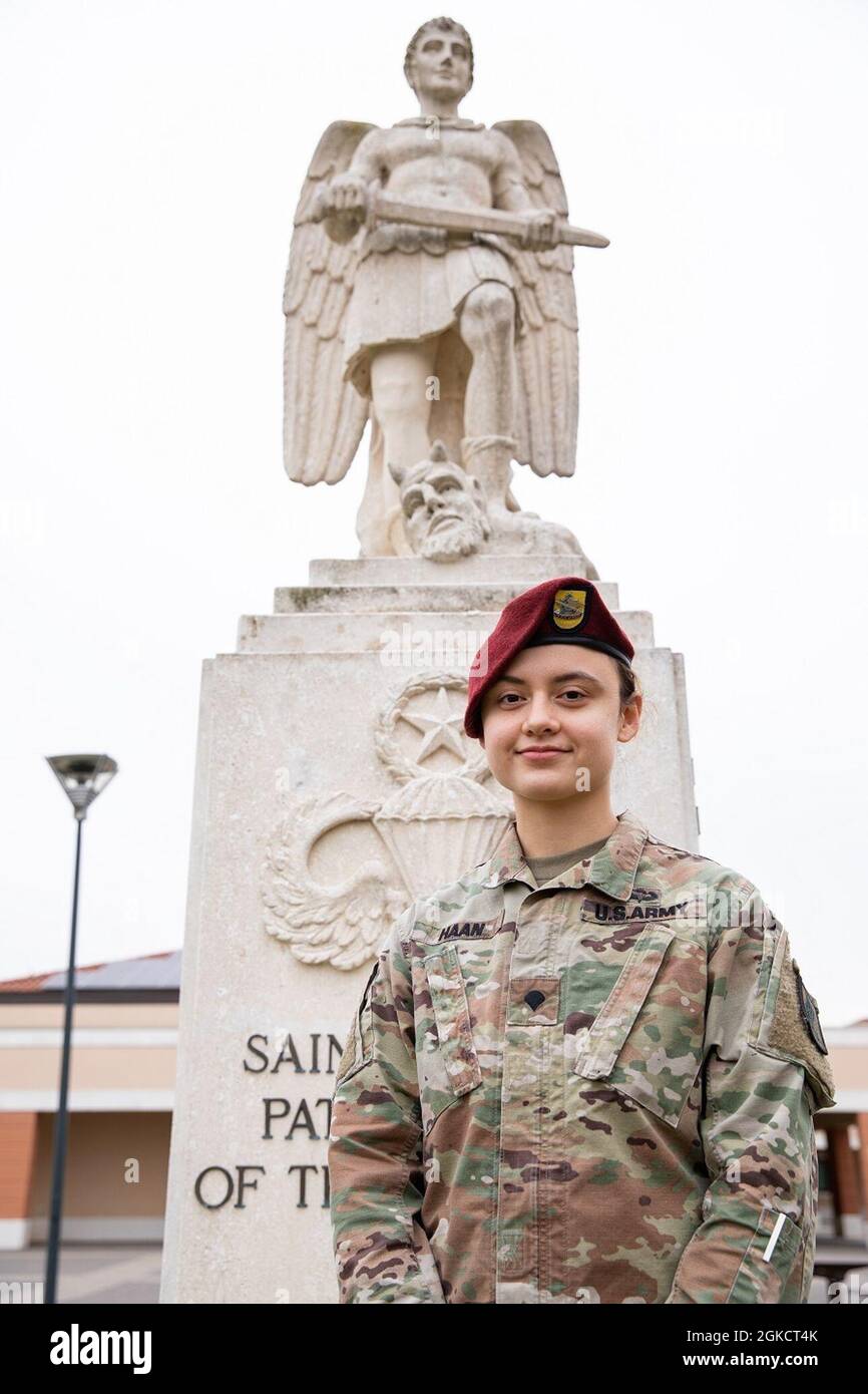 Spc. Rachel Haan, combat medic assigned to the 173rd Brigade Support Battalion (Airborne), 173rd Airborne Brigade, located on Caserma Del Din in Vicenza, Italy, poses in front of the statue of St. Michael, patron saint of the paratroopers. Italy has been her first overseas assignment since she joined the Army in March 2020. Stock Photo