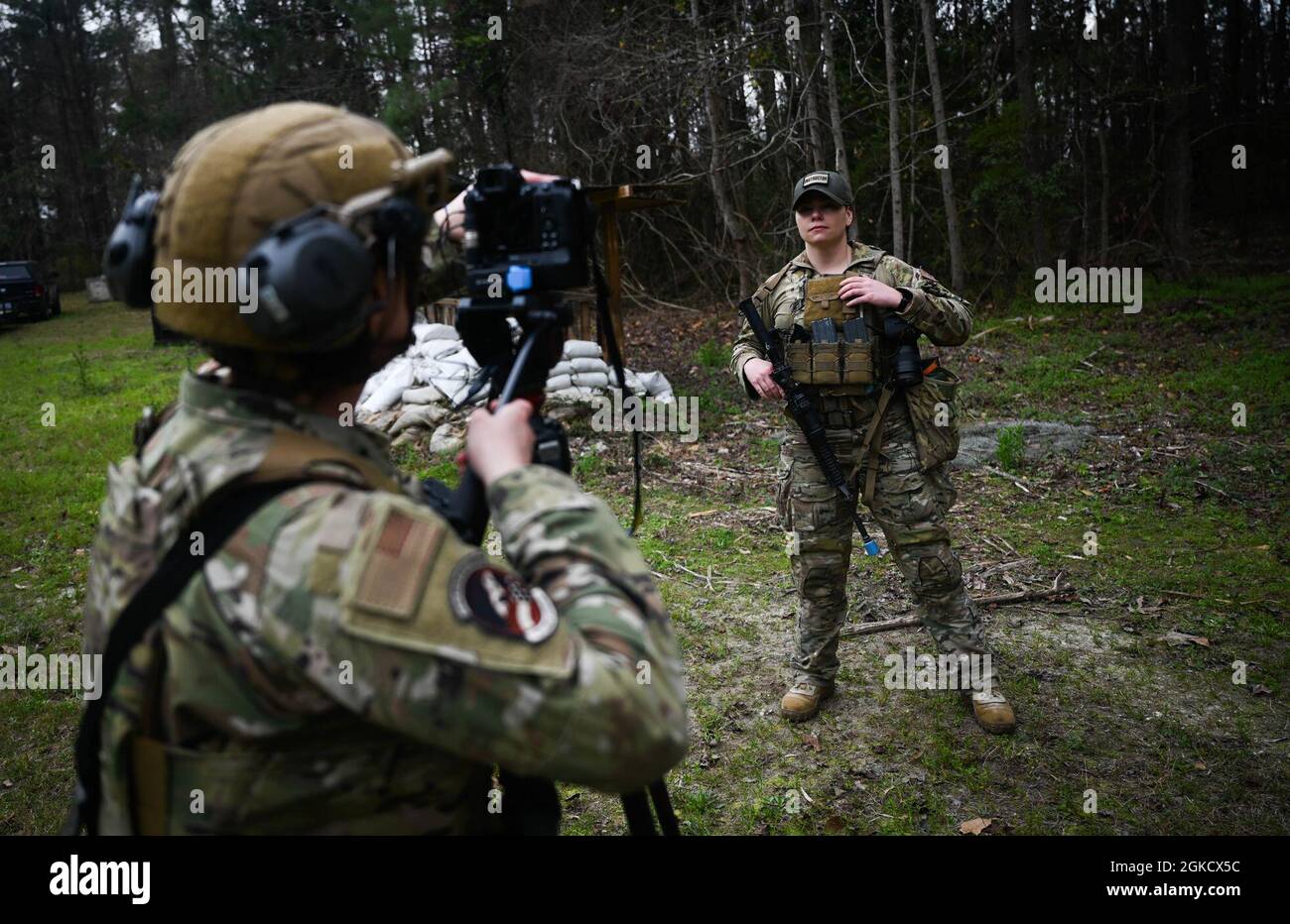 U.S. Air Force Staff Sgt. Cambria Ferguson, a combat videographer assigned to the 1st Combat Camera Squadron (1st CTCS), conducts an interview with U. S. Air Force Senior Airman Kelly Walker, also a combat photographer assigned to the 1st CTCS, during Exercise Scorpion Lens at Joint Base Charleston, South Carolina, March 16, 2021. Scorpion Lens is an annual 1st Combat Camera Squadron exercise, that tests Combat Camera team members leadership, documentation skills, and the tactical expertise of the unit’s public affairs, and mission support airmen. Stock Photo