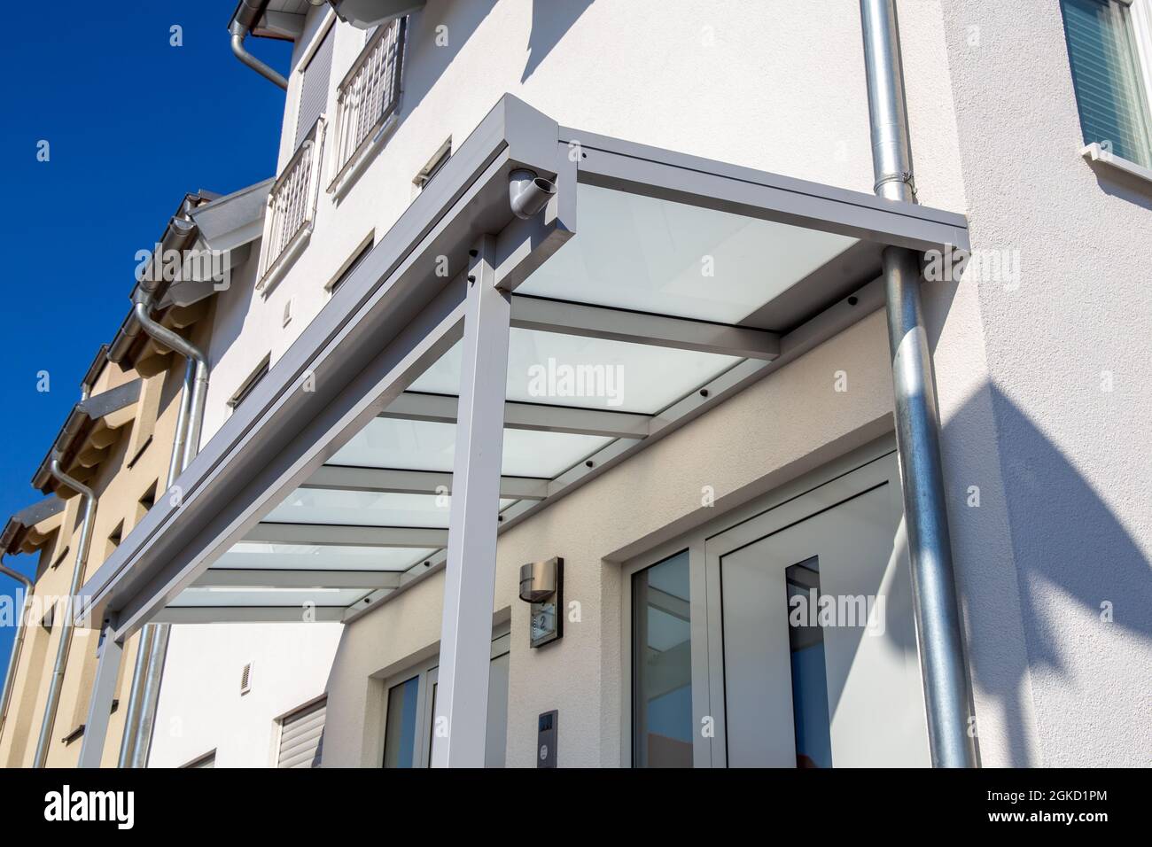 New glass canopy on a residential building Stock Photo Alamy
