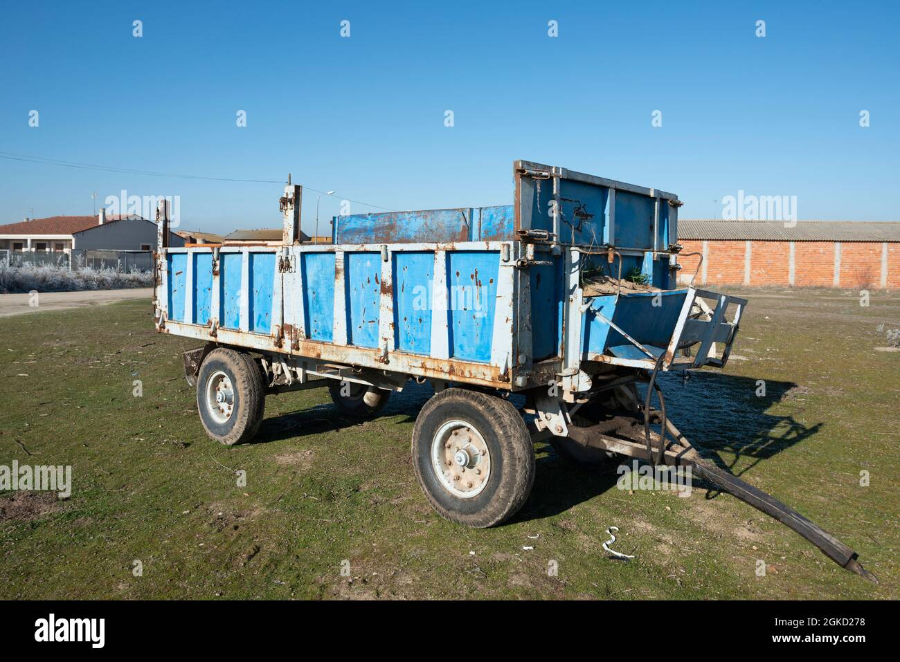 Blue wagon for the transport of grain and straw used intensively in a farm in castilla, spain