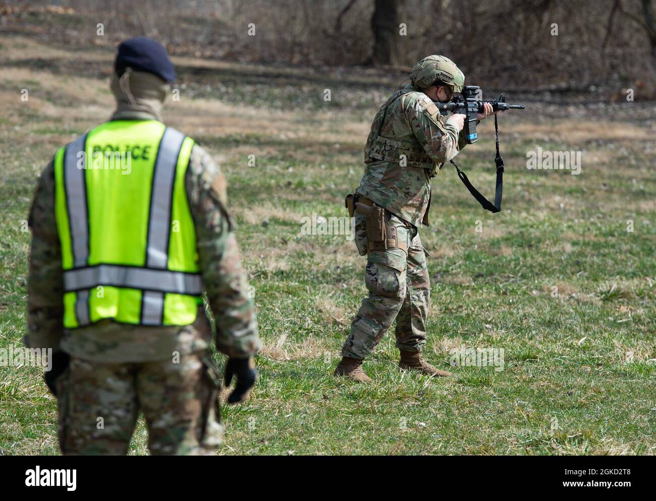 A member of the 88th Security Forces Squadron fires a simunition round ...