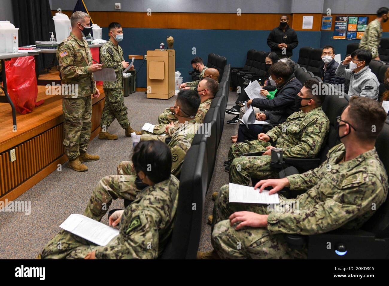 N Zu848 01 Chinhae Republic Of Korea Mar 17 21 Master Sgt Matthew Roth And Hospital Corpsman James Woo Brief Personnel Before They Receive The Janssen Covid 19 Vaccine At Commander Fleet Activities Chinhae Sailors