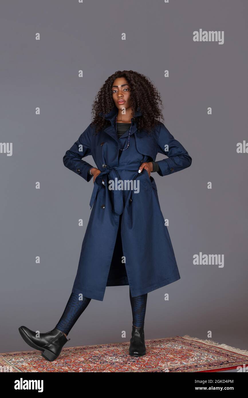 Portrait of a tall black woman with long curly black hair, beautiful ...