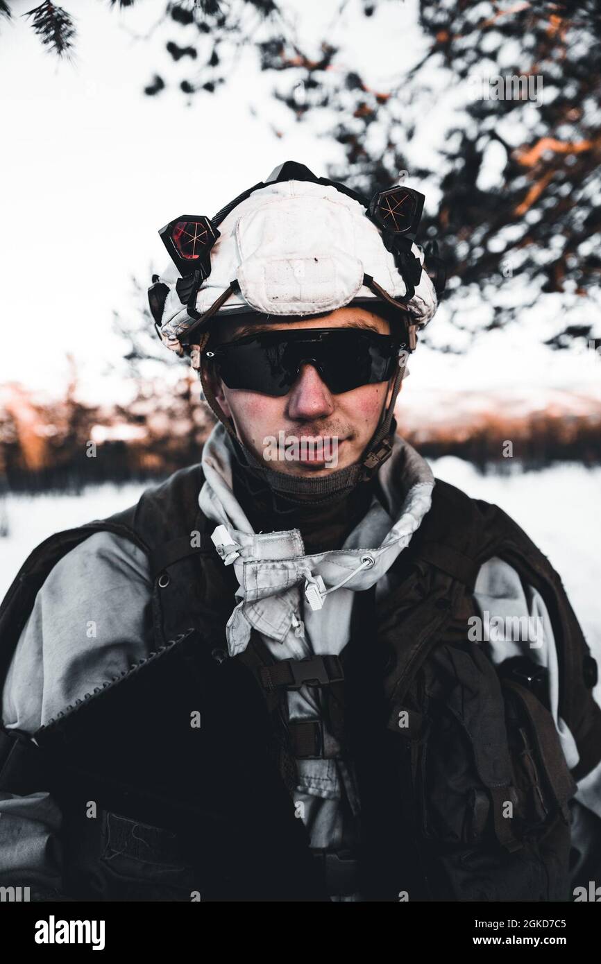 A Norwegian Army Soldier poses for a portrait in Øverbygd, Norway, March 18, 2021. The Norwegian Army participated in an integrated combat engineers training event with Marines from Marine Rotational Force Europe 21.1 (MRF-E). MRF-E focuses on regional engagements throughout Europe by conducting various exercises, arctic cold-weather and mountain warfare training, and military-to-military engagements, which enhance overall interoperability of the U.S. Marine Corps with allies and partners. Stock Photo