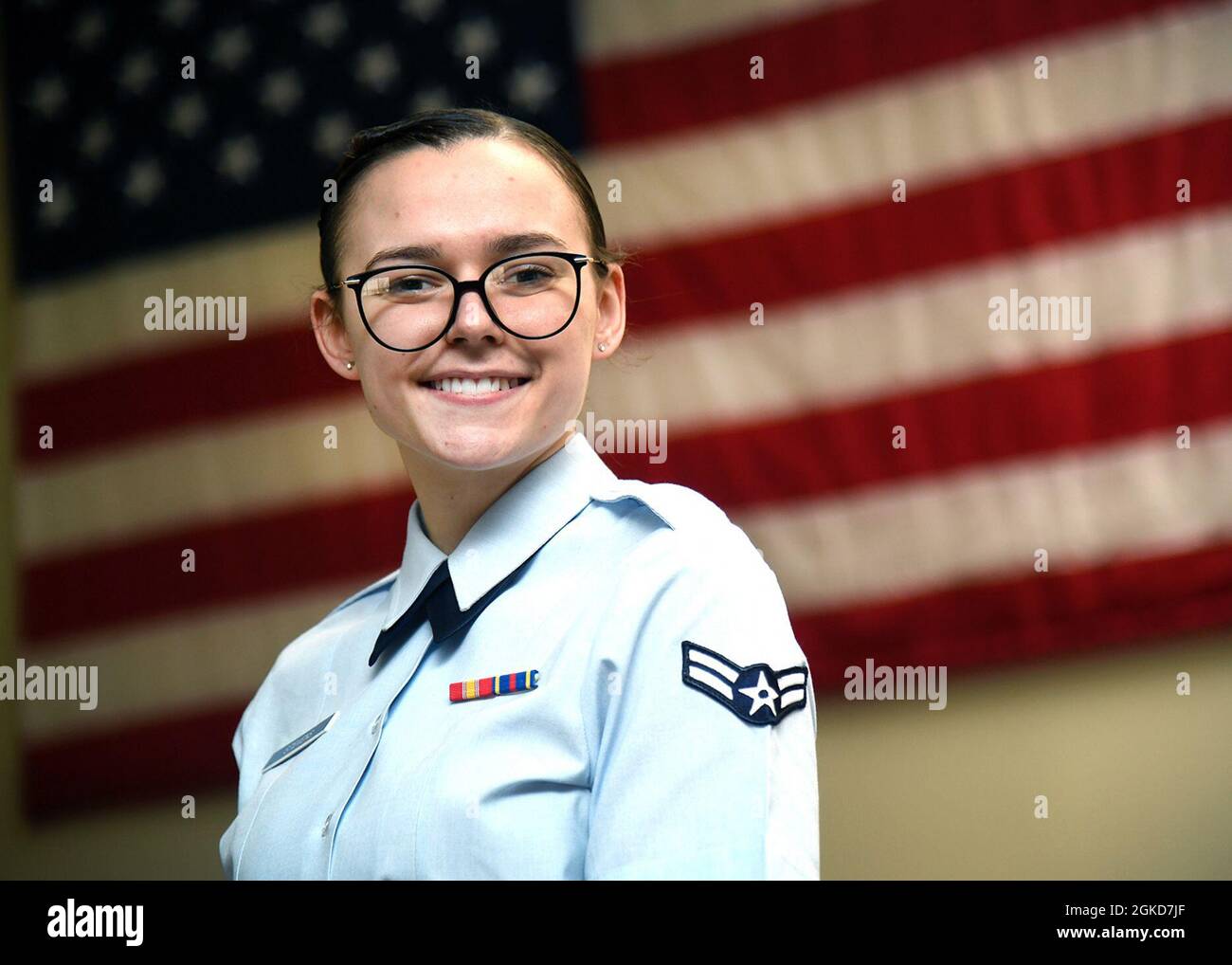 Airman 1st Class Kayla Stevens, 66th Air Base Group Office of the Staff Judge Advocate paralegal, poses for a photo in the Legal office at Hanscom Air Force Base, Mass., March 18, after winning the 2020 Air Force Materiel Command Olan G. Waldrop, Jr. Unsung Hero Award. The 66 ABG JA office is also home to the AFMC Outstanding Legal Office and Civilian Attorney of the Year, Rachel D'Orazio, all of whom will go on to compete at the Air Force-level. Stock Photo