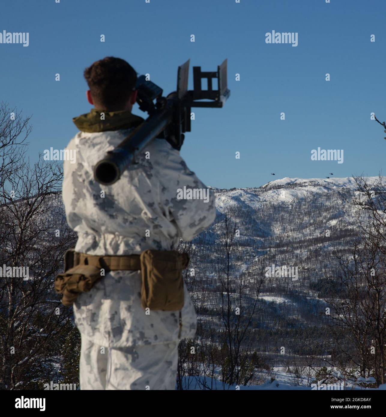A U.S. Marine with Marine Rotational Force Europe 21.1 (MRF-E), Marine Forces Europe and Africa, utilizes the FIM-92 Stinger during a routine training event in Setermoen, Norway, March 18, 2021. This event focused on locating and notionally shooting down air threats. MRF-E focuses on regional engagements throughout Europe by conducting various exercises, arctic cold-weather and mountain warfare training, and military-to-military engagements, which enhance overall interoperability of the U.S. Marine Corps with allies and partners. Stock Photo