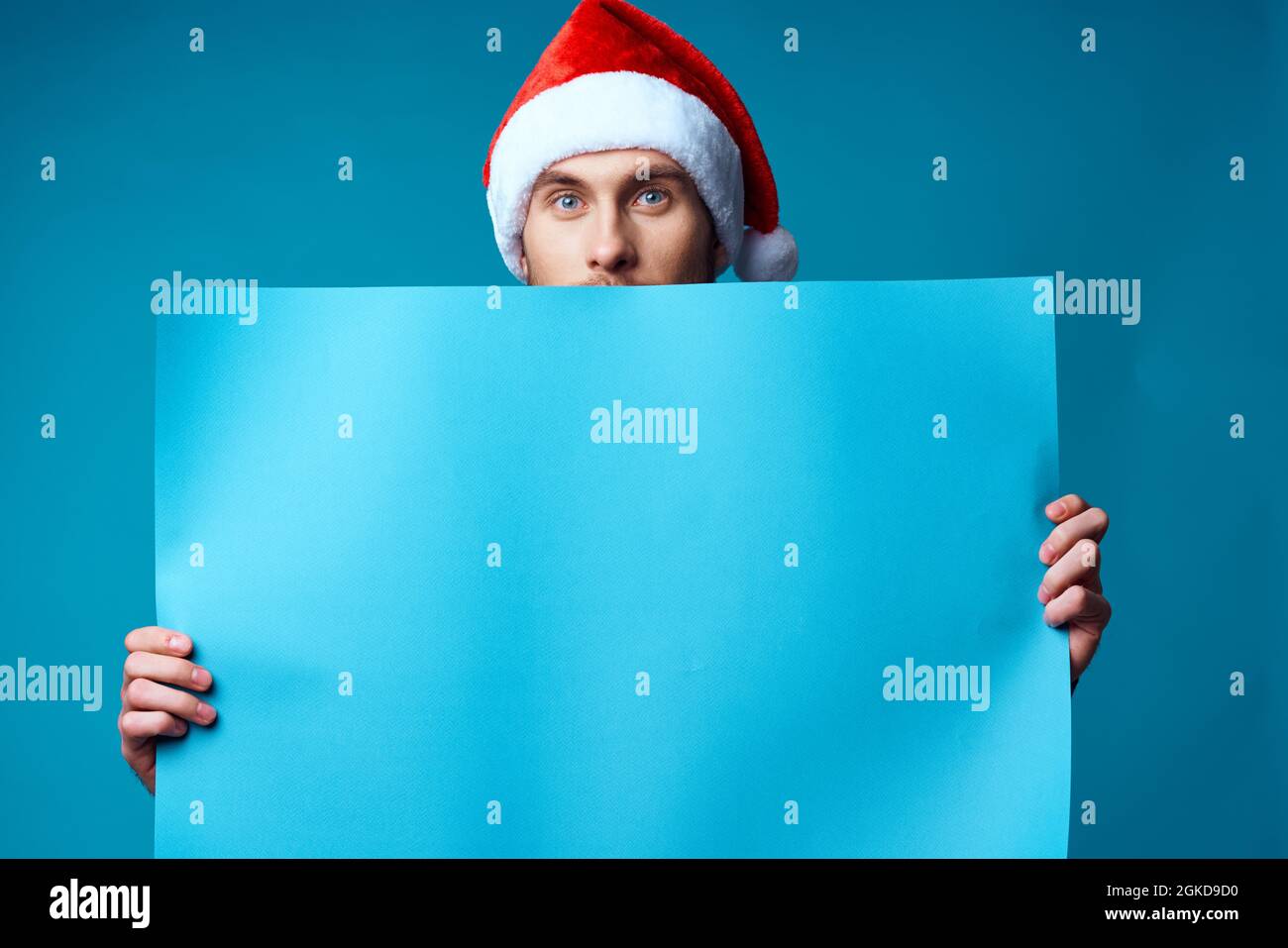emotional man in a santa hat holding a banner holiday isolated ...