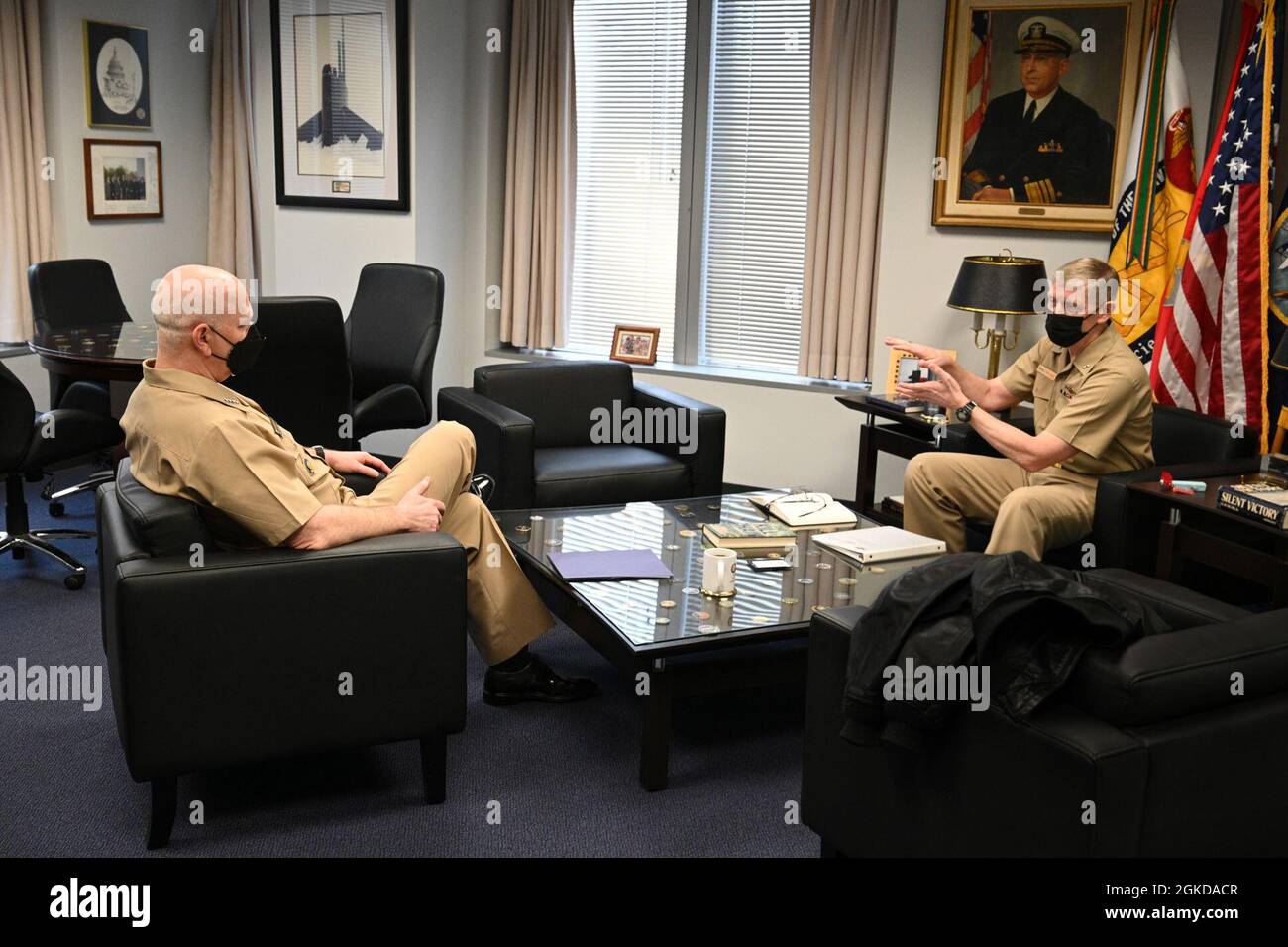 210319-N-UH269-021 ARLINGTON, Va. (March 19, 2021) Adm. Christopher W. Grady, commander of U.S. Fleet Forces Command, talks with Rear Adm. Lorin Selby, chief of naval research, during a visit to the Office of Naval Research (ONR) in Arlington, Virginia. While at ONR, Grady was briefed on the current and emerging technologies the Naval Research Enterprise is providing the fleet and force. Stock Photo
