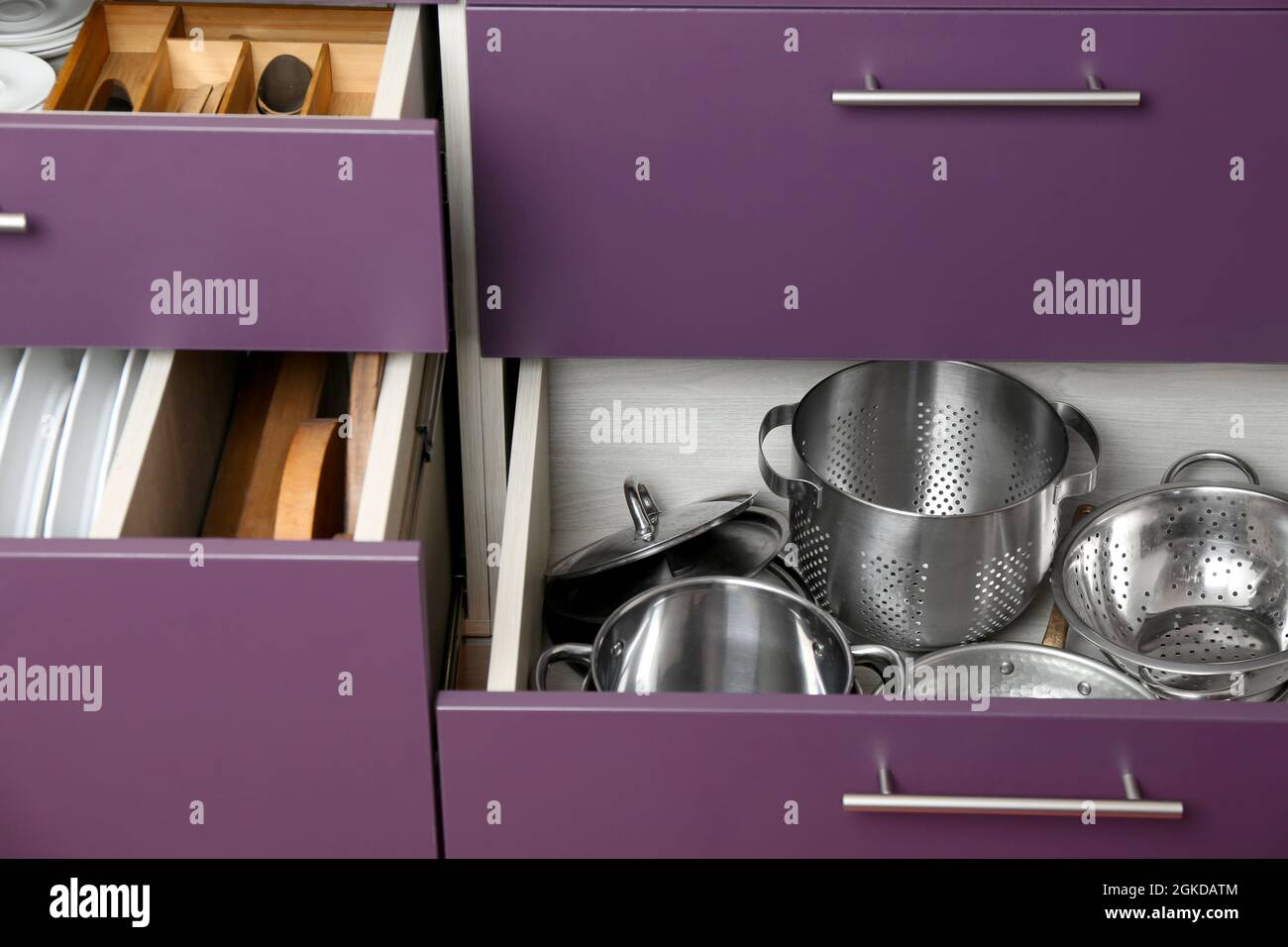 Different kitchenware in drawers Stock Photo - Alamy