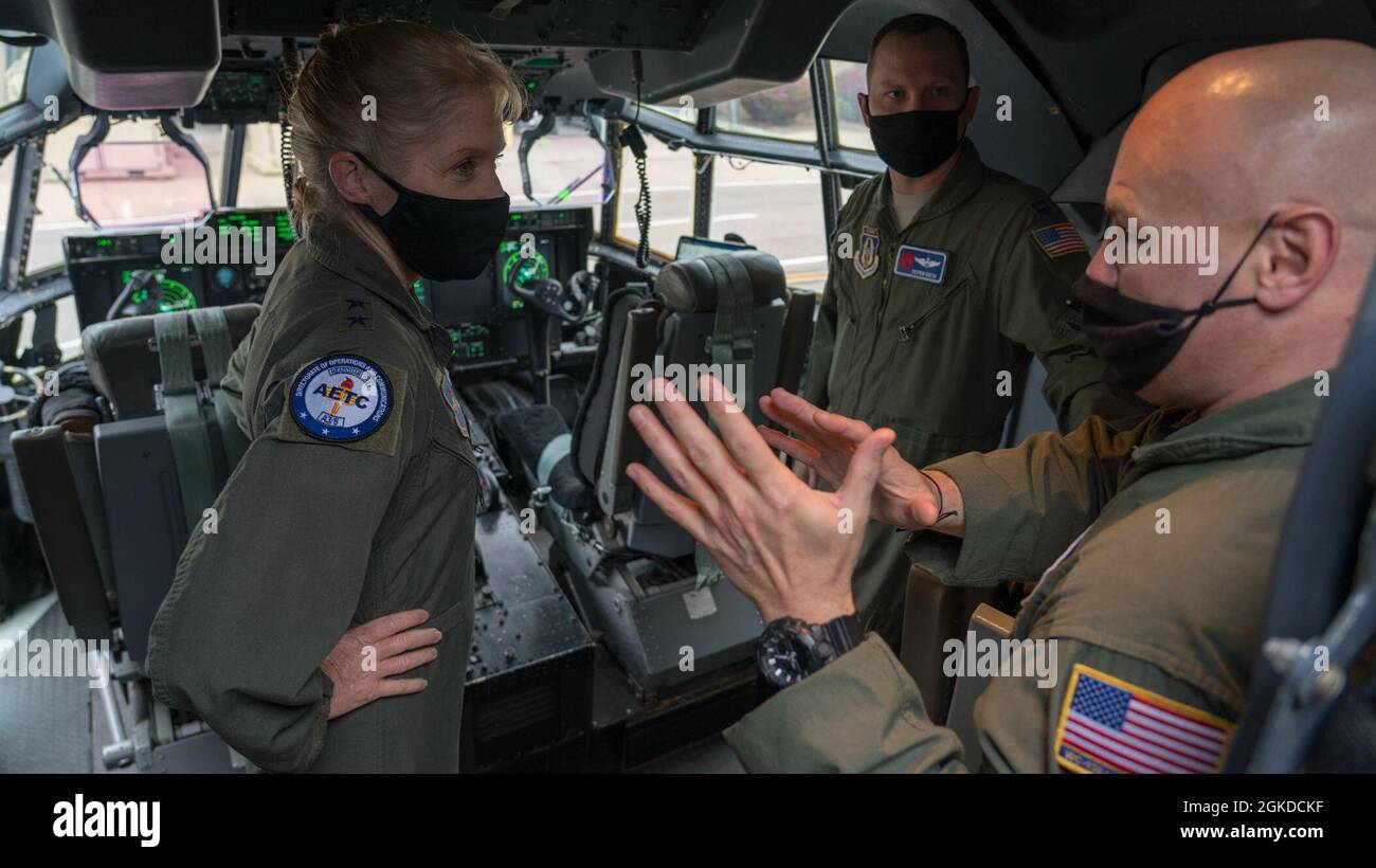 Maj. Gen. Jeannie M. Leavitt, director of operations and communications for the Air and Education Training Command at Joint Base San Antonio-Randolph, Texas, learns about the 53rd Weather Reconnaissance Squadron 'Hurricane Hunters' from Capt. Peyton Eustis (center), pilot for the 53rd WRS, and Master Sgt. Ed Scherzer (right), loadmaster for the 53rd WRS, during a visit at Keesler Air Force Base, Miss., March 19, 2021. After joining the Air Force in 1992, Leavitt became the branch's first female fighter pilot in 1993. She visited the 81st Training Wing and the Air Force Reserve's 403rd Wing, an Stock Photo