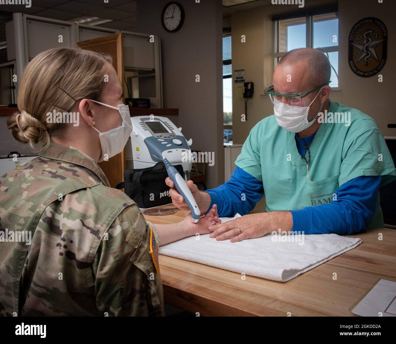 Kelly Jones, certified occupational therapy assistant, performs an