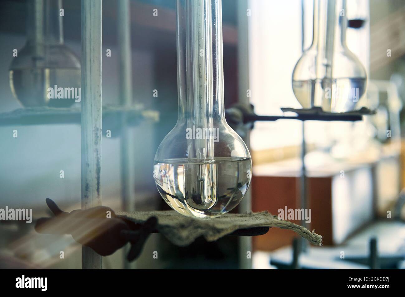 Vintage equipment of chemical laboratory. Antique lab glass flasks